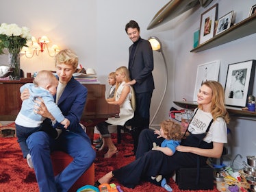 Mom, supermodel Natalia Vodianova, sitting on floor in her apartment with five children and husband.