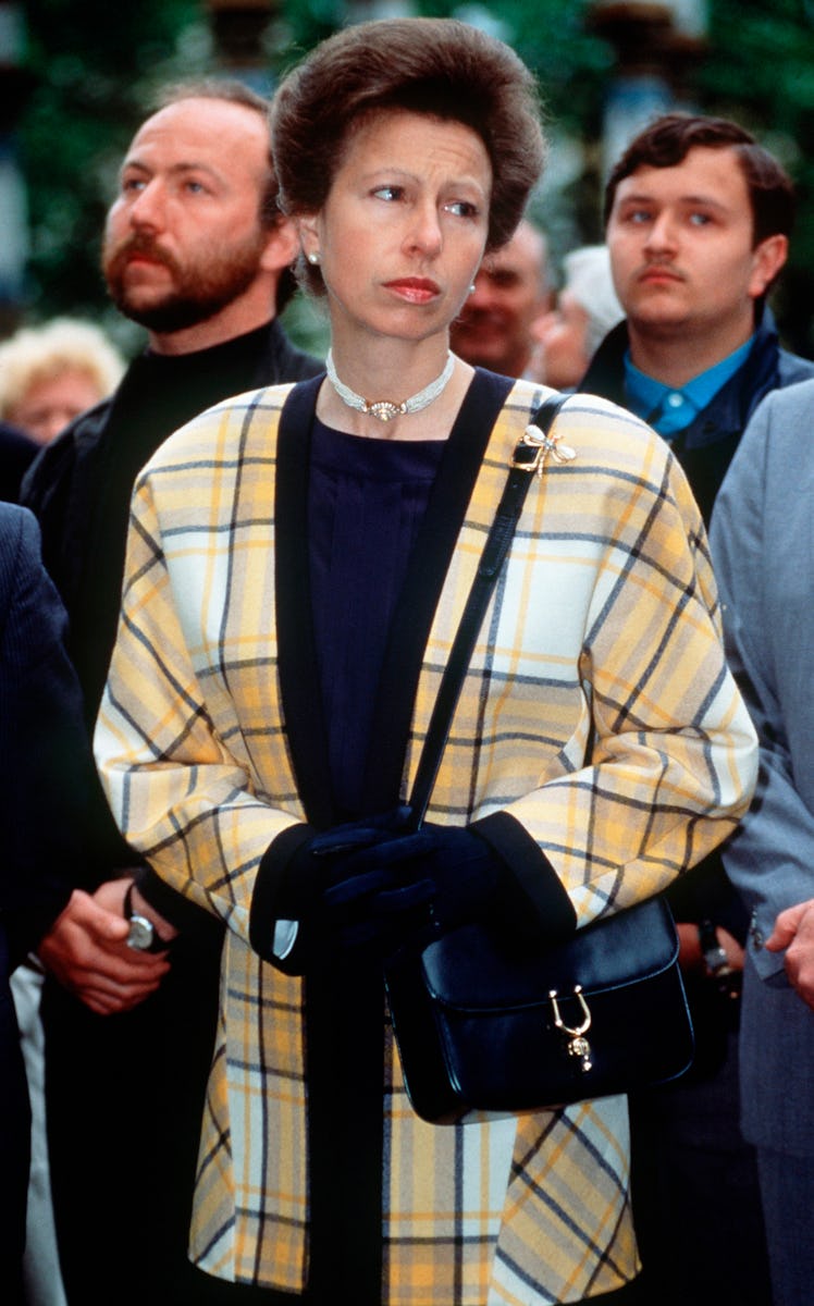 Princess Anne wearing a yellow and black plaid jacket
