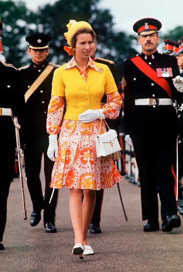 Princess Anne wearing a bold yellow and orange ensemble