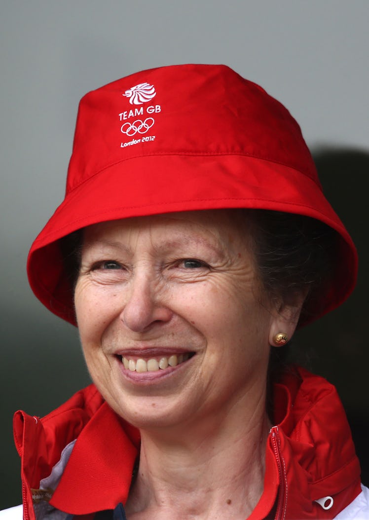 Princess Anne wearing a bright red bucket hat