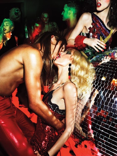Models kissing next to a disco ball for Mert and Marcus' ‘Back In the Lime Light’ editorial