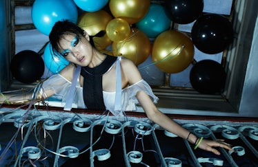Sunghee Kim dressed for New Year's Eve party with balloons over her head