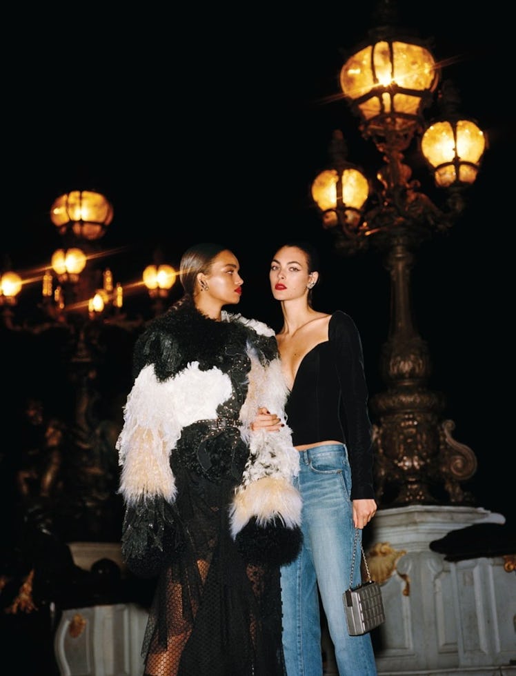 Models dressed for the New Year's Eve party standing in front of the street lights