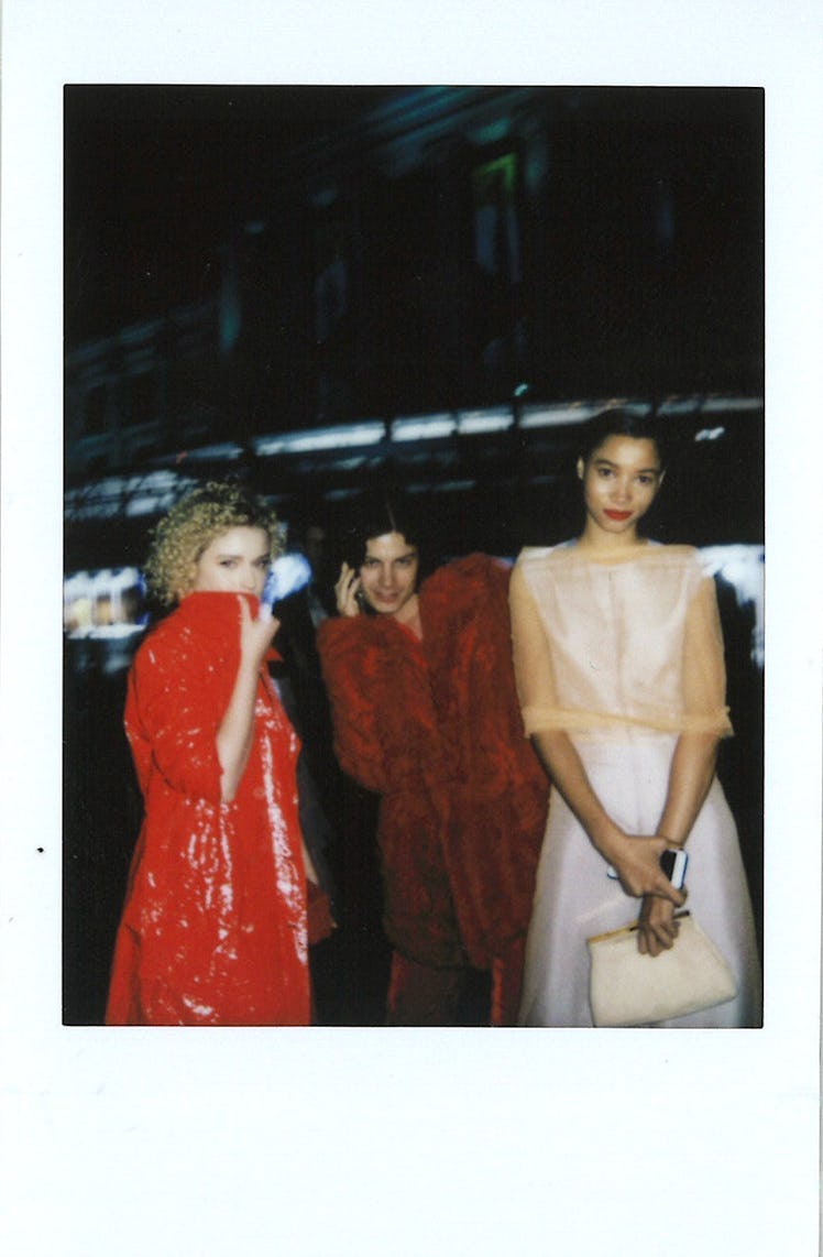 Julia Garner in a red jacket, BØRNS in a burgundy jacket, and Lineisy Montero in a white dress