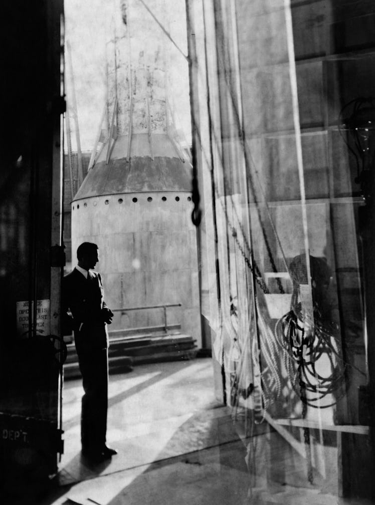 Gary Cooper standing in a suit photographed by Cecil Beaton