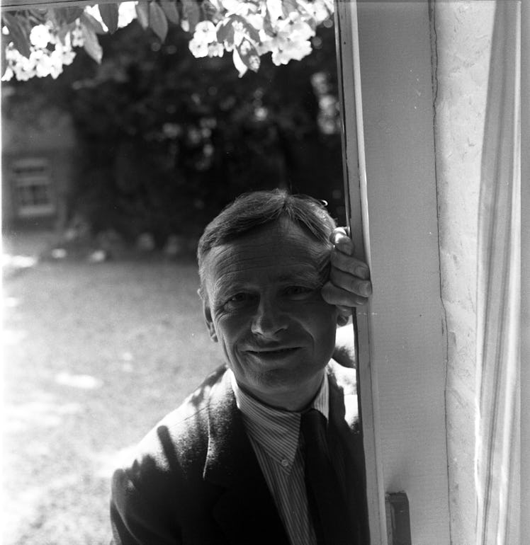 Christopher Isherwood leaning on a door photographed by Cecil Beaton
