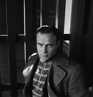 Marlon Brando in front of wooden boards photographed by Cecil Beaton