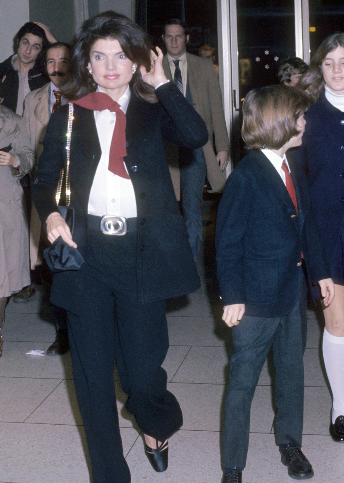 Jackie O wearing a suit