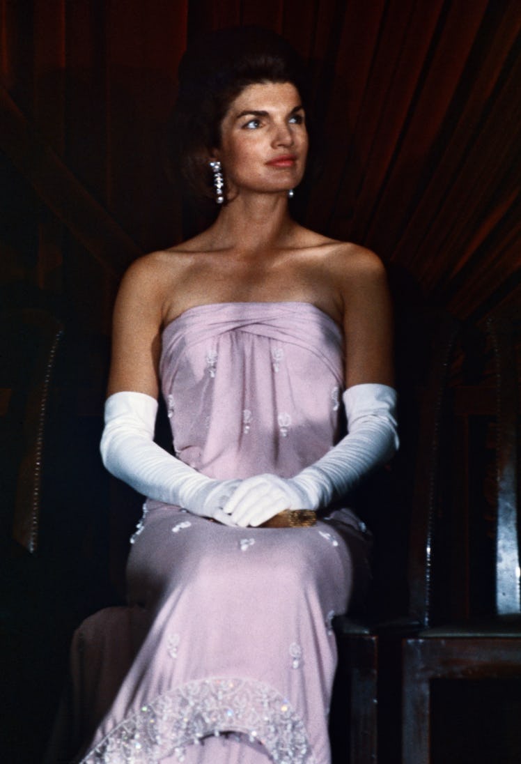 Jackie Kennedy in a strapless lavender evening gown and white elbow-length gloves at the National Ga...
