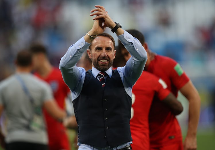 Gareth Southgate greeting English fans in a black waistcoat after winning the Sweden England Quarter...