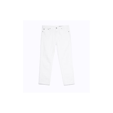 A pair of white AG straight-leg jeans with frayed hem
