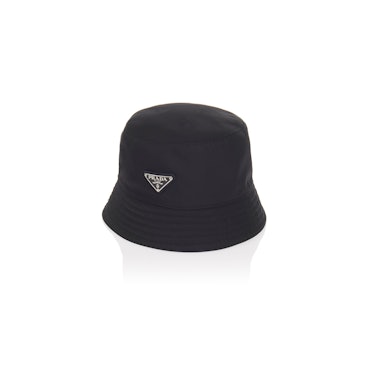 A black bucket Prada hat with a small logo