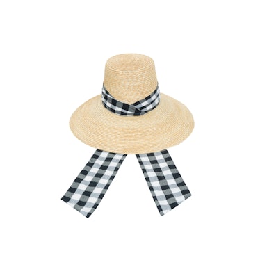 A straw hat with a black-white gingham print scarf-like element by LHD x Maison Michel