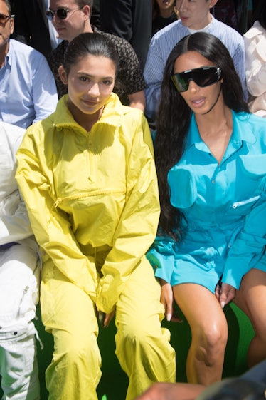 Kylie Jenner and Kim Kardashian attend the Louis Vuitton Menswear Spring/Summer 2019 show as part of...