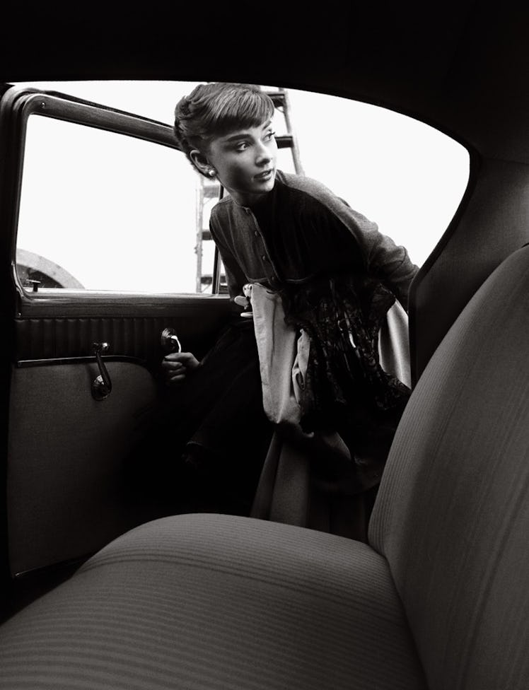 Audrey Hepburn getting into the Paramount Studios car, 1953, Bob Willoughby.jpg