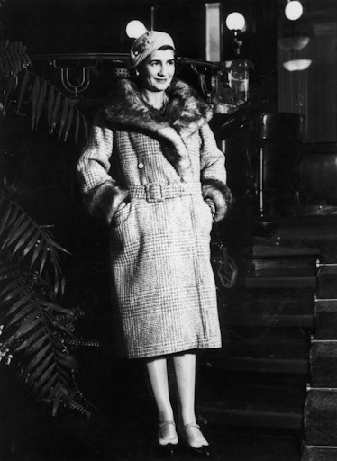 Coco Chanel swathed in a big fur coat, 1920s