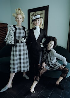 Swinton wears a Chanel jacket, dress, necklace, brooch, bracelet, and shoes; Perrin Paris gloves. Ly...