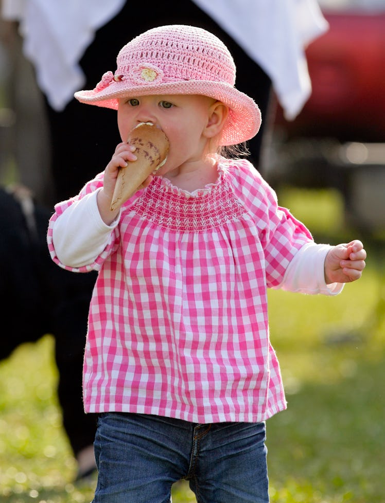 Savannah Phillips eating ice-cream at the Gatcombe Horse Trials in 2012.
