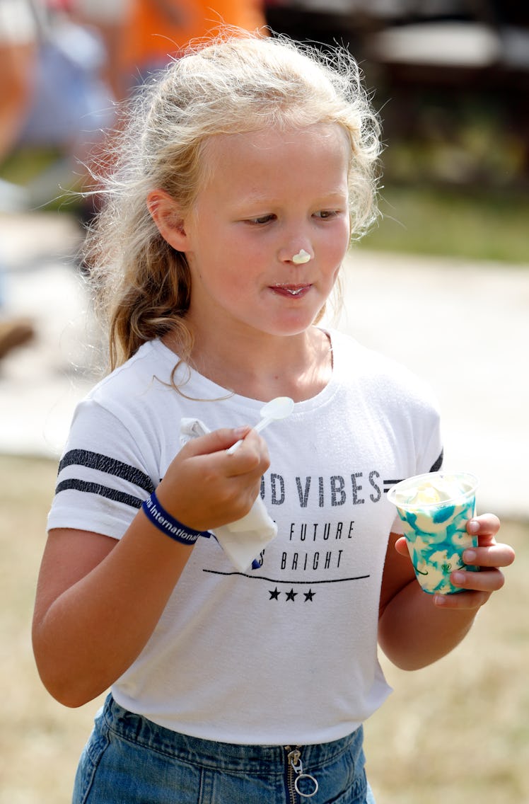 Savannah Phillips eating ice-cream wearing a cute white t-shirt.