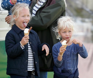 Savannah Phillips eating an ice-cream with her little sister Isla Phillips.