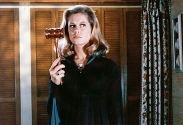 Elizabeth Montgomery wearing all-black, holding a gavel in 'Bewitched'