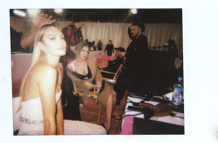 Candice Swanepoel and Gigi Hadid in hair and makeup backstage at the 2018 VSFS show 