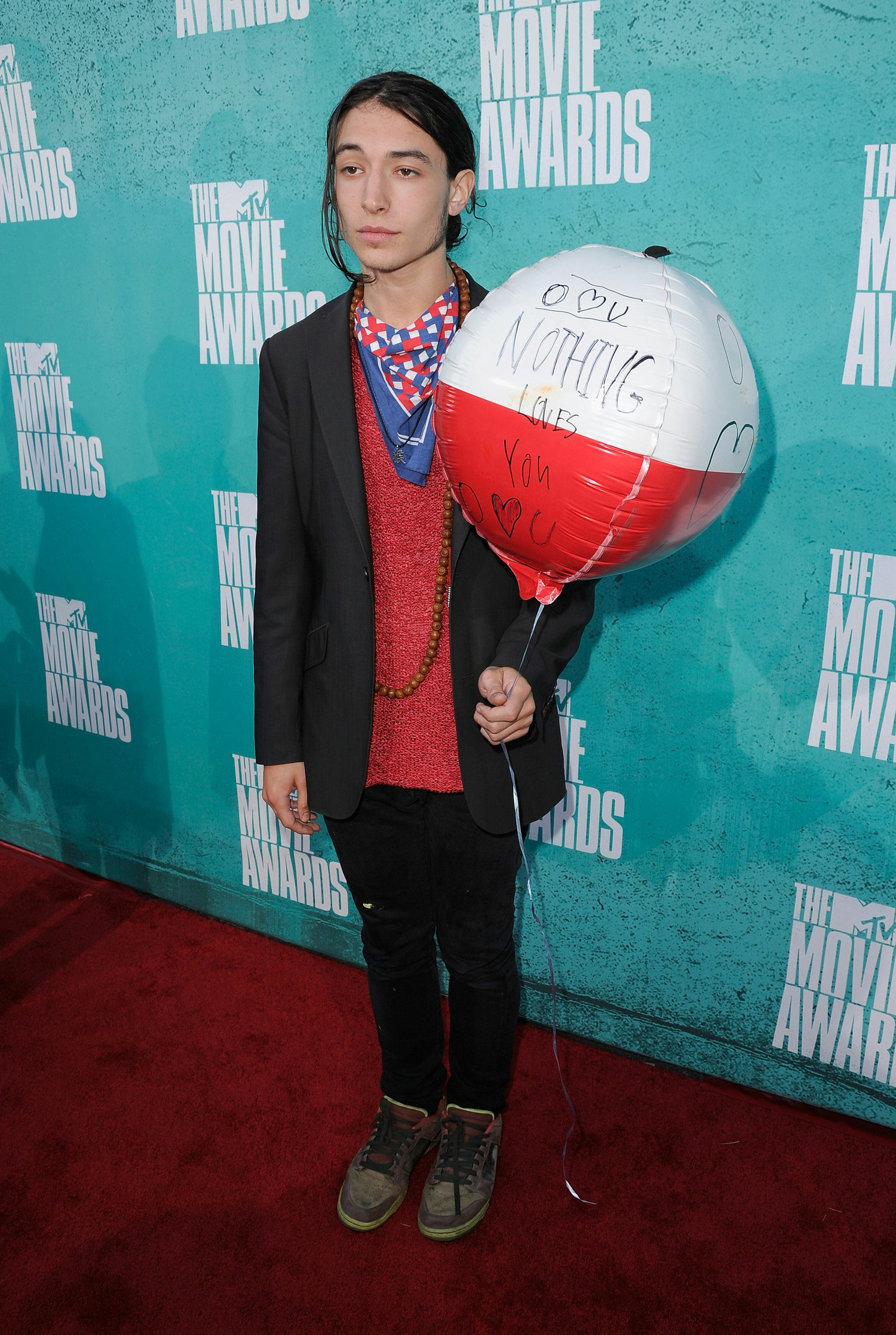 Ezra Miller’s Red Carpet Journey Into a Glittery Hedwig