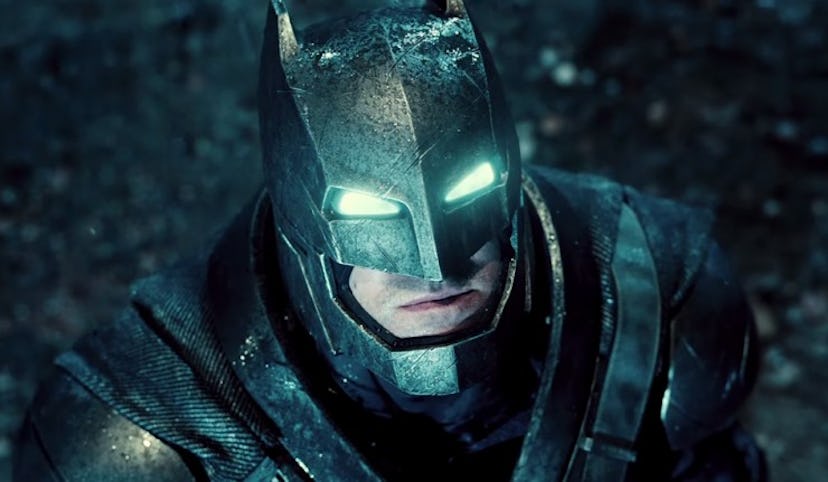 Batman wearing an iron suit which is wet because of rain