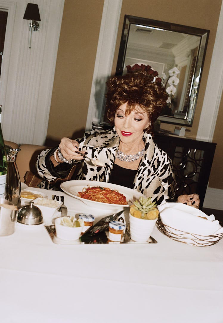 Joan Collins eating spaghetti 