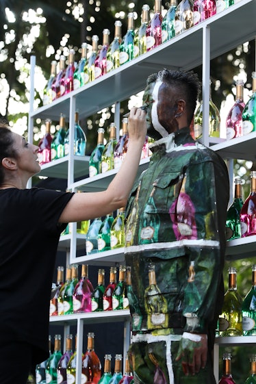 Liu Bolin during his performance at the Miami Botanical Garden at the Ruinart x Art Basel Miami Beac...