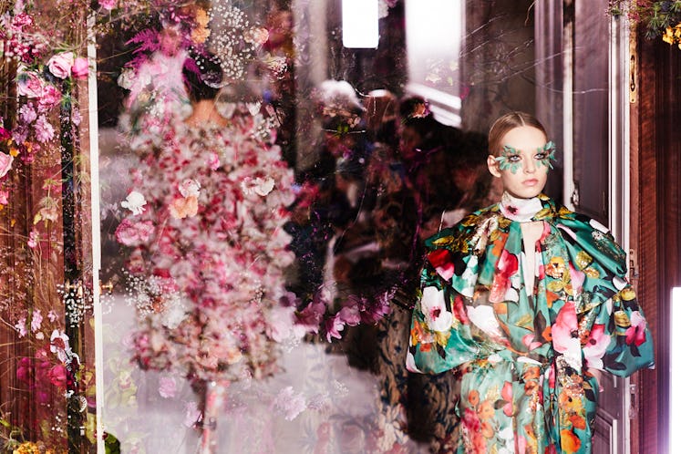 Models wearing bright flower-patterned gowns at Valentino Haute Couture show in Paris