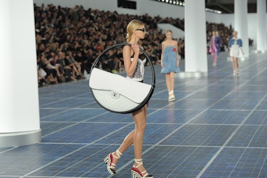 10 years after its debut on the Chanel catwalk, the Hoop bag