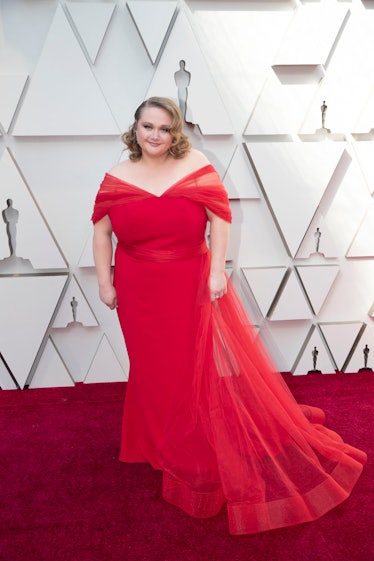 Danielle Macdonald in a red gown at the 2019 Oscars Red carpet 