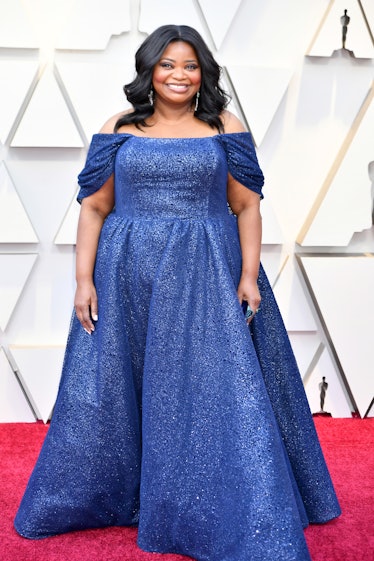 Octavia Spencer posing in a blue gown at the 2019 Oscars Red carpet 