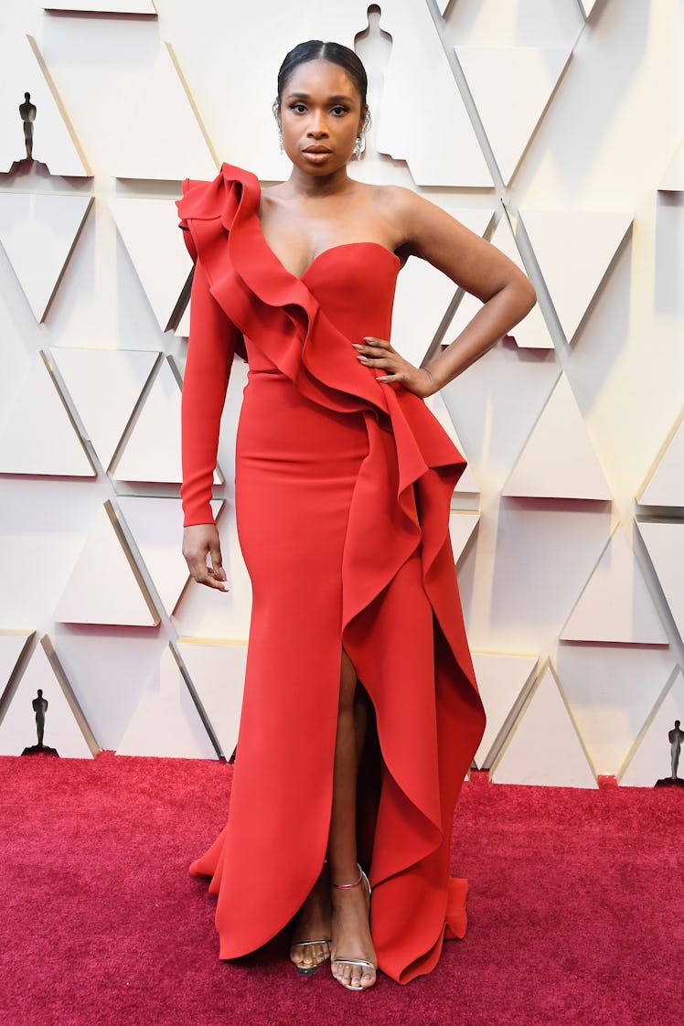 Jennifer Hudson wearing an orange gown while attending the 2019 Oscars Red carpet 