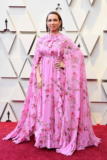 Maya Rudolph wearing a pink floral gown while attending the 2019 Oscars Red carpet 