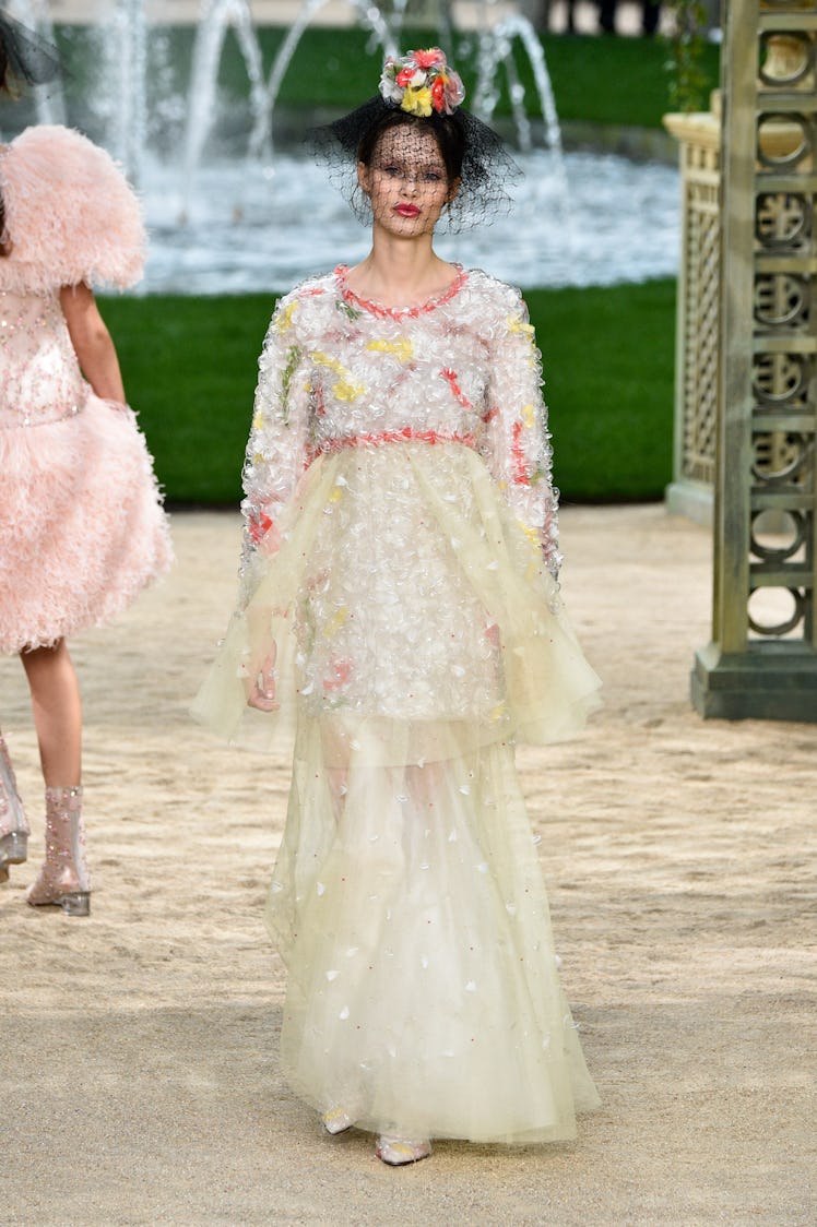 Kris Grikaite walking the runway during the Chanel Spring-Summer 2018 fashion show.
