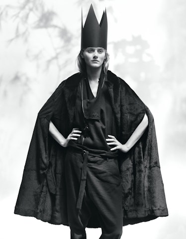 Ann Demeulemeester's black weasel fur and leather cape and black wool, linen, and cotton coat and pa...
