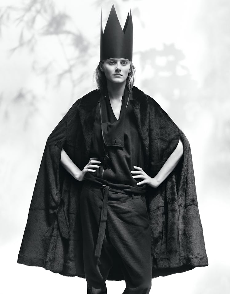 Ann Demeulemeester's black weasel fur and leather cape and black wool, linen, and cotton coat and pa...