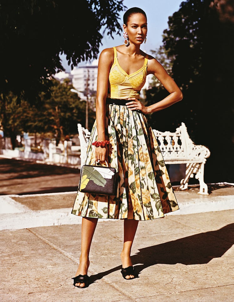 Rosamosario leotard; Marc Jacobs skirt; Miu Miu earrings; Kenneth Jay Lane bracelet; Mark Cross bag;...