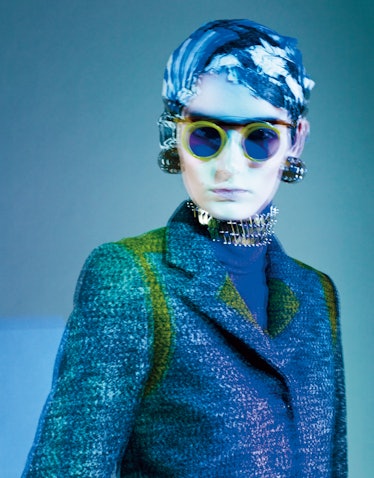 Kenzo wool blend jacket. Louis Vuitton polyester turtleneck. Prada sunglasses; Sharra Pagano earring...
