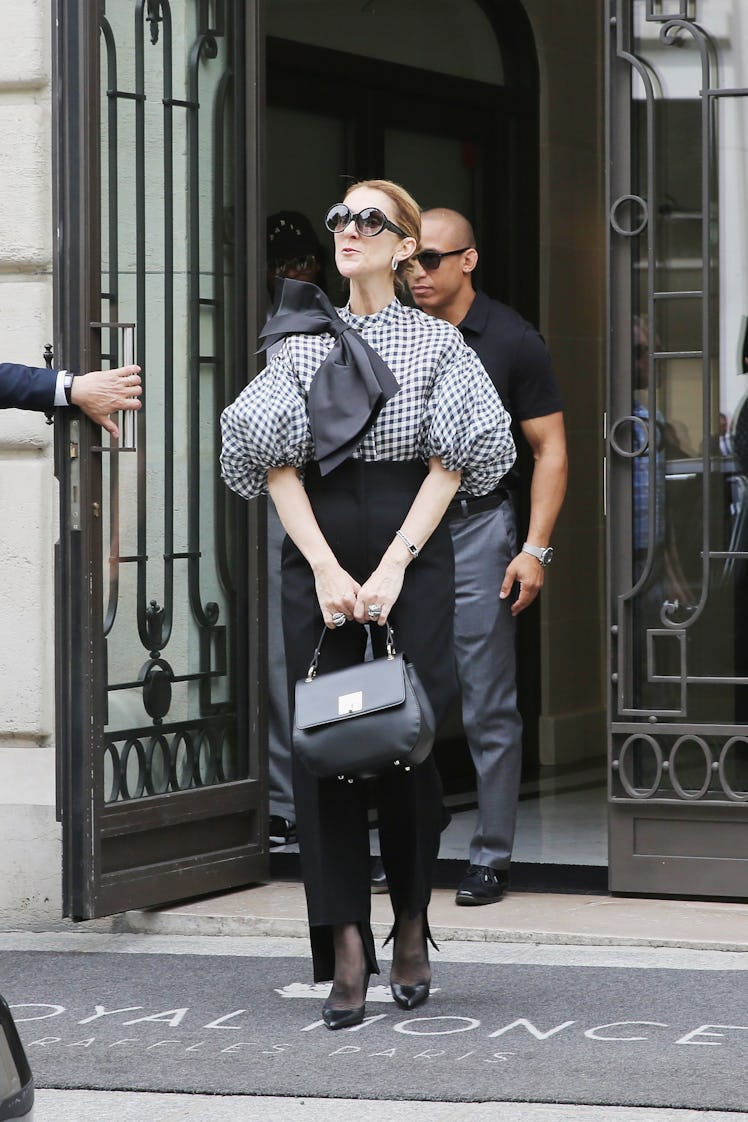 Singer Celine Dion seen wearing Dice Kayek top, Celine pants, Tom Ford shoes and bag from Celine Dio...