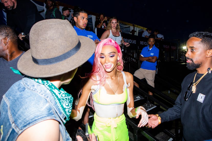 Winnie Harlow attending the Moschino party in Indio, California, during Coachella in a white-yellow ...