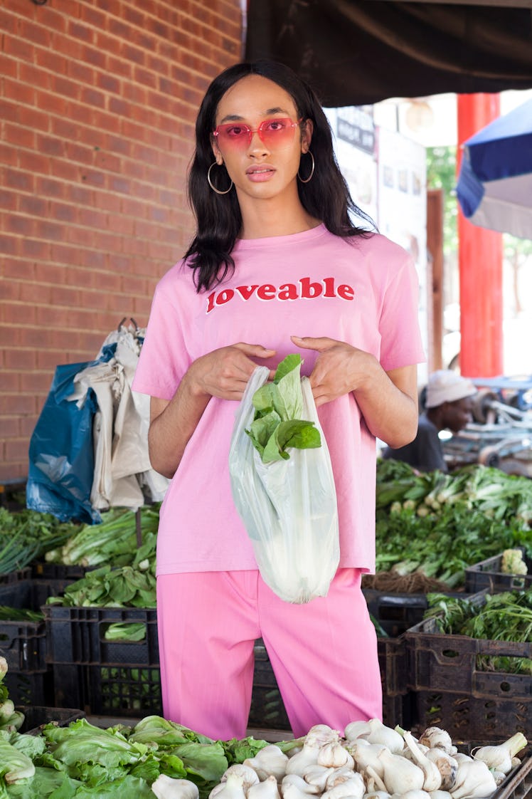 Woman in all pink shopping for vegetables