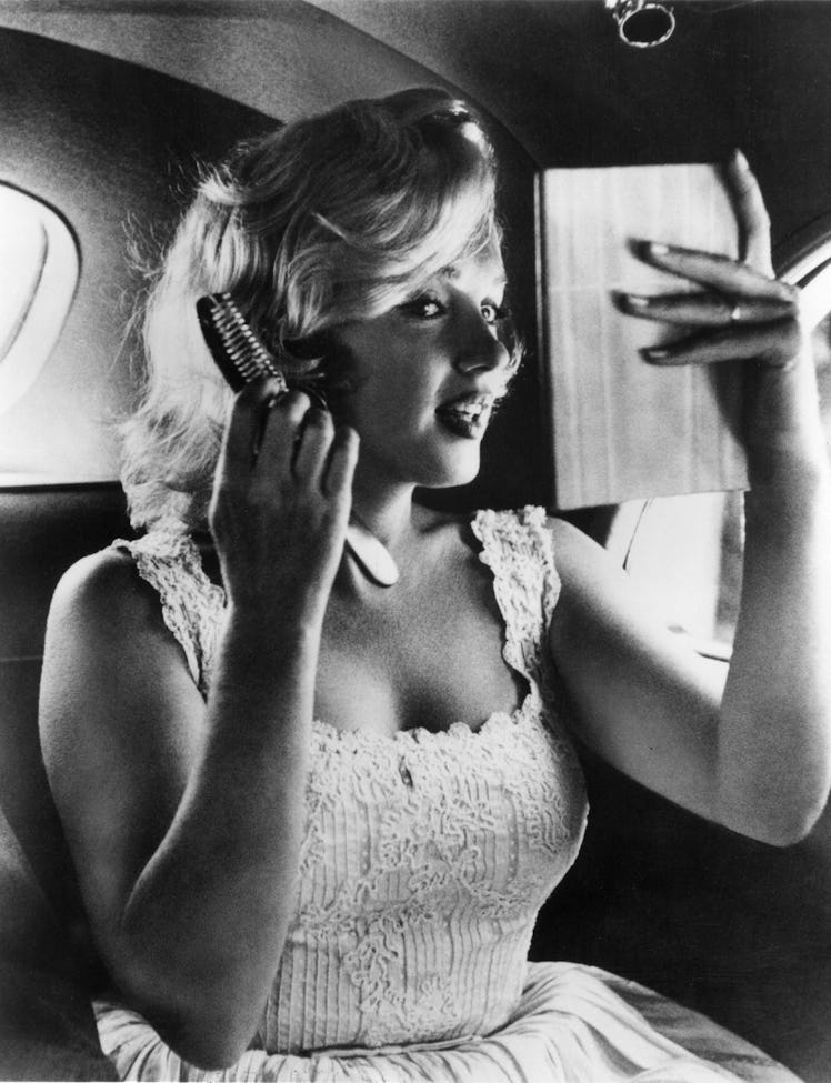 Marilyn Monroe in car in Manhattan, 1957