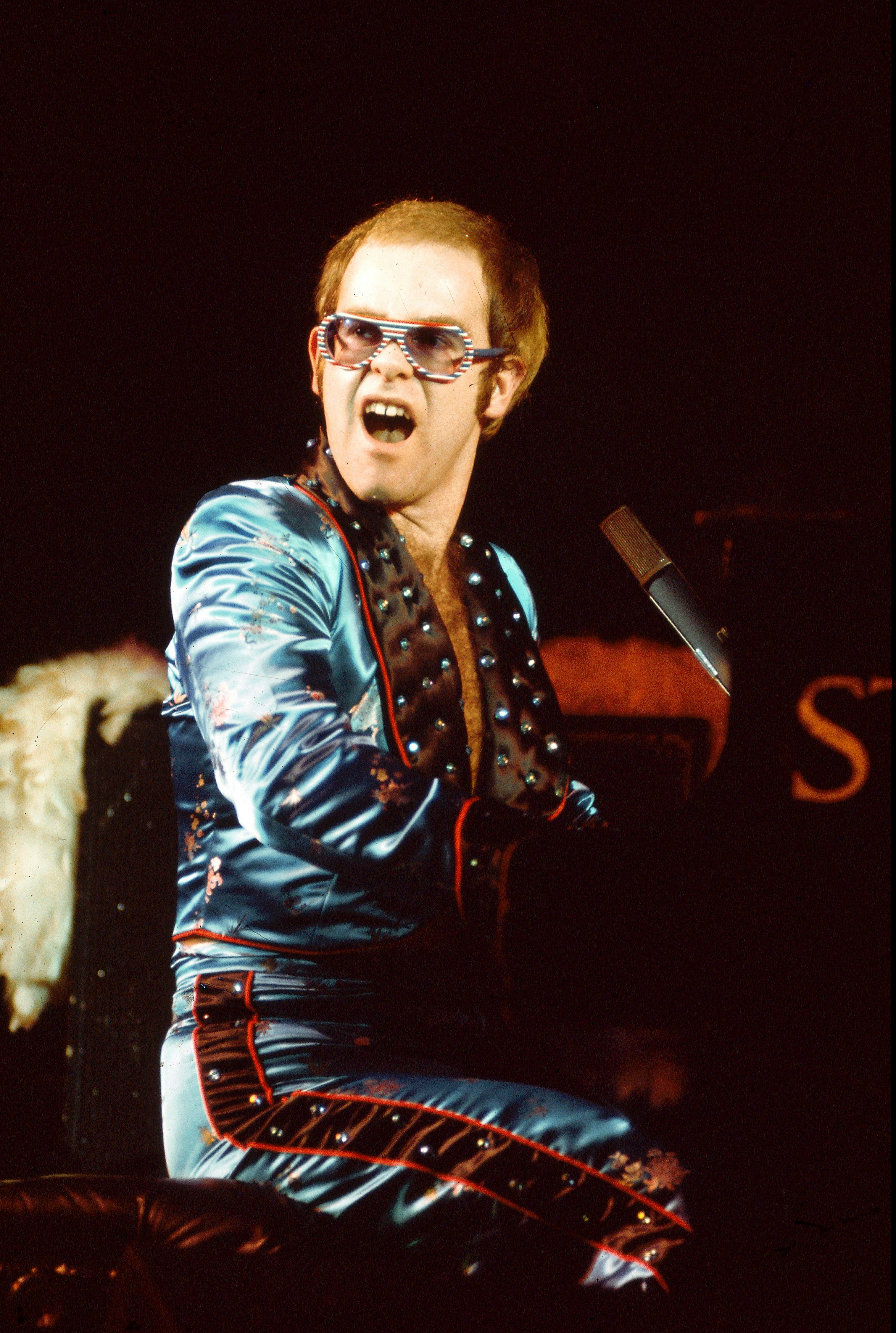 A Visual History Of Elton John’s Flashiest, Larger-than-Life Looks