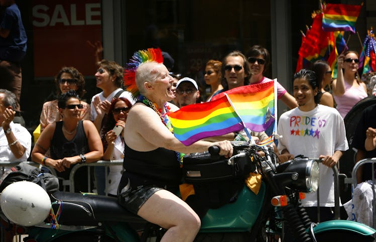 Woody Woodward of the Sirens Motorcycle Club rides down Fift