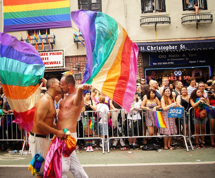 Gay Pride Parade - Two Men Kissing