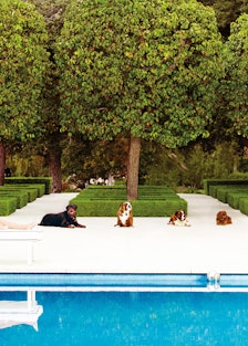 Sitting Pretty.Petra Ecclestone lounging poolside at her new palace.Omo Norma Kamali's stone-embelli...