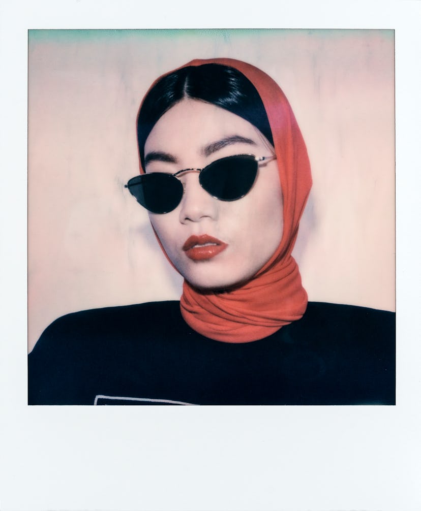 Versace hood and sweatshirt; Oliver Peoples sunglasses.